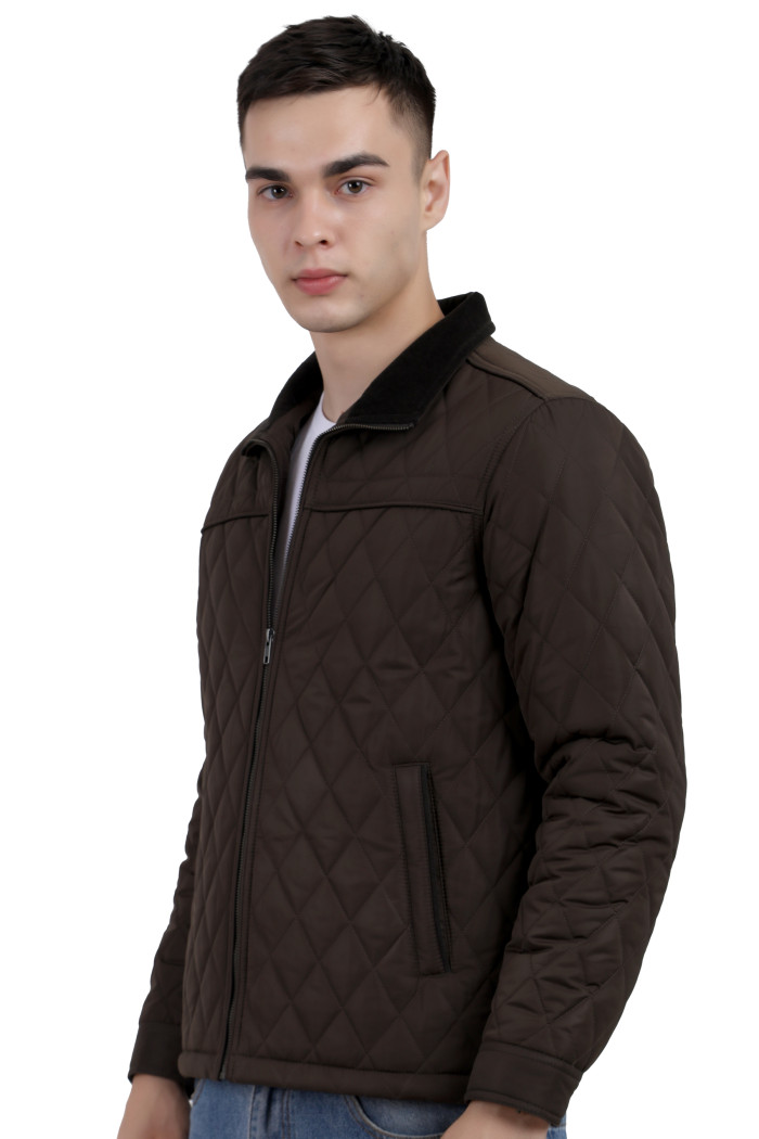 A right pose of a man wearing a Dark Olive quilted jacket with a collar neck, zipper closure and pocket in hand designed for casual winter layering and comfort.